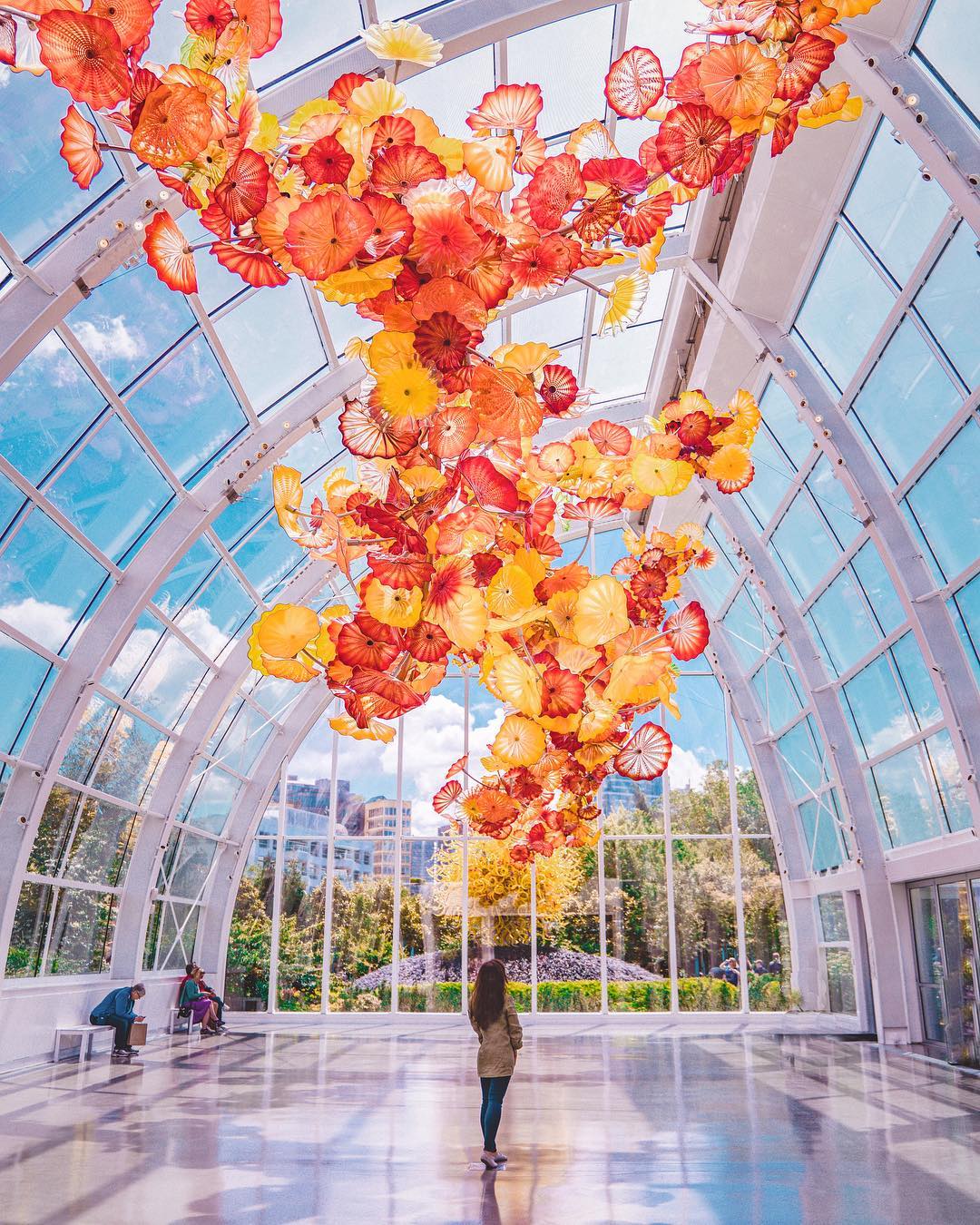 Red and yellow glass flowers at the Chihuly Garden in Seattle. Photo by Instagram user @nastasiaspassport
