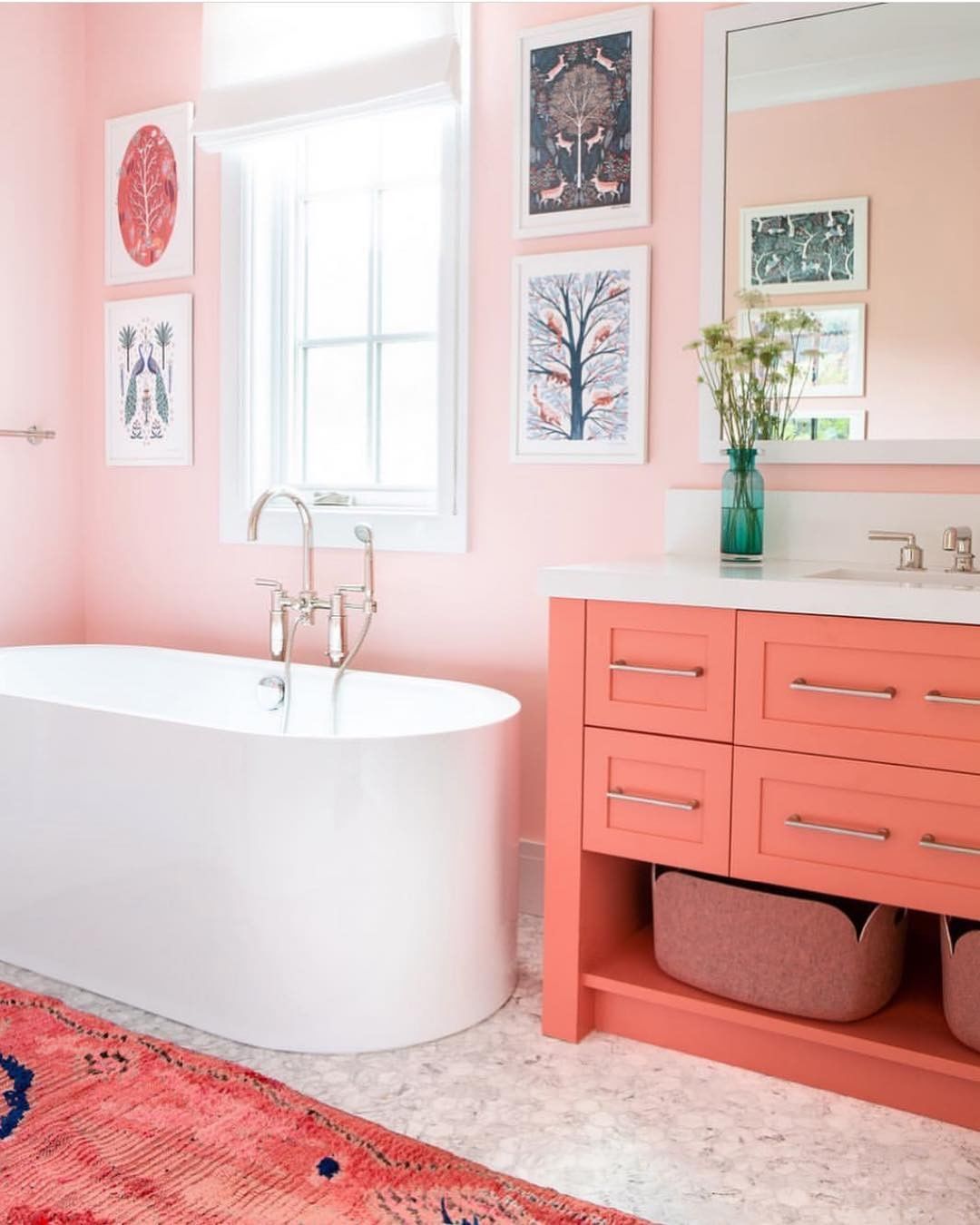 Bathroom with all pink walls and counters and bathtub. Photo by Instagram user @selliottphoto