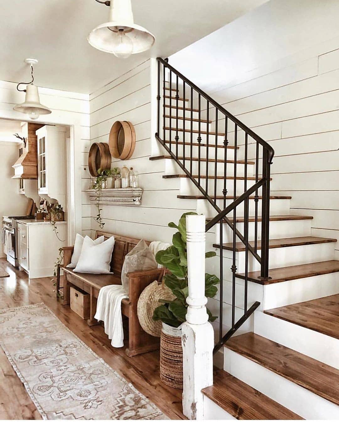 Entryway decorated in Modern Farmhouse with all white walls. Photo by Instagram user @whitetailfarmhouse