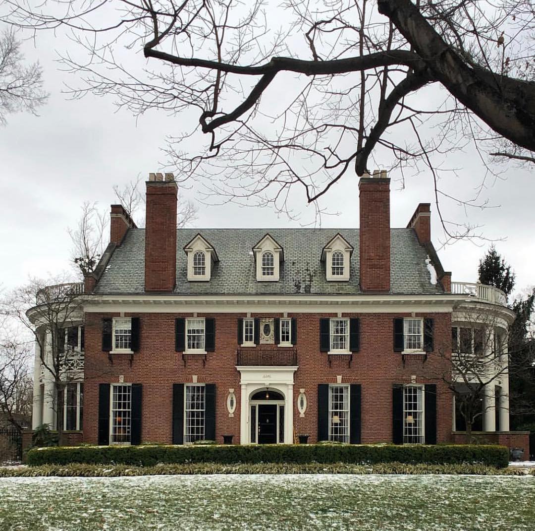Two-story brick house with black shutters in Highlands Douglass, Louisville. Photo by Instagram user @thatkentuckygirl