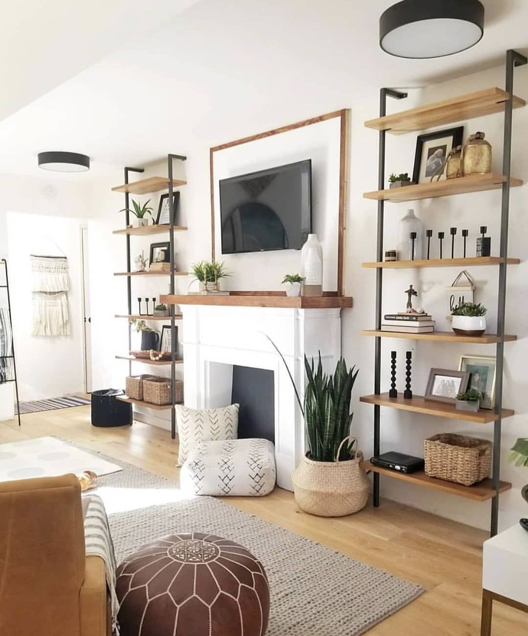 Living room painted white with brown decor for a Feng Shui design. Photo t\by Instagram user @kaza.karis