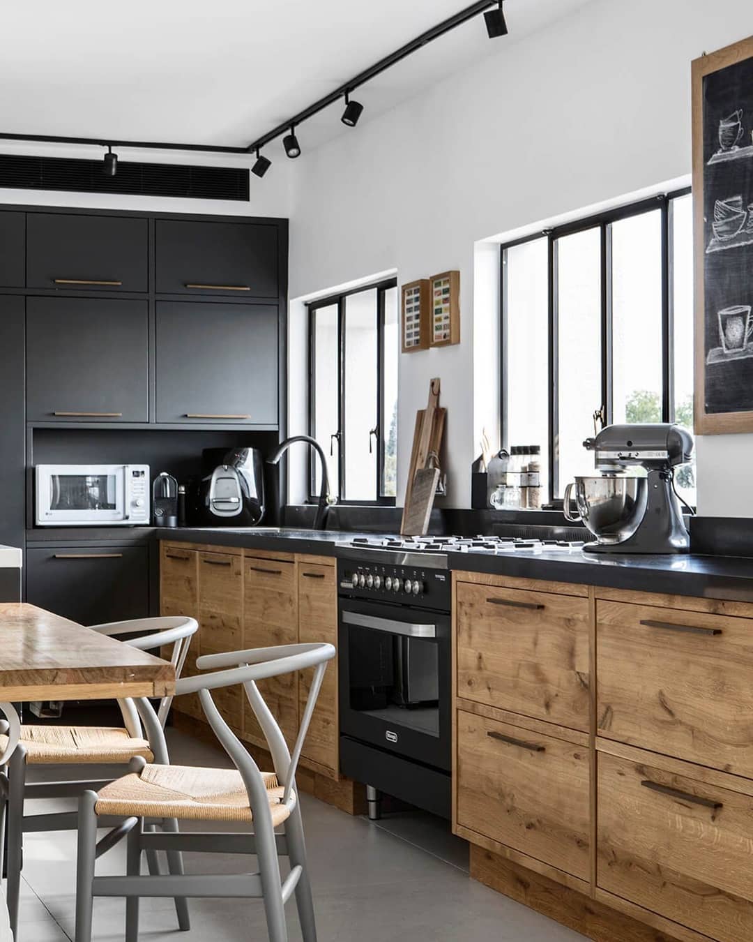 Black and gray and wood kitchen designed in Industrial style. Photo by Instagram use @arpinharutunian