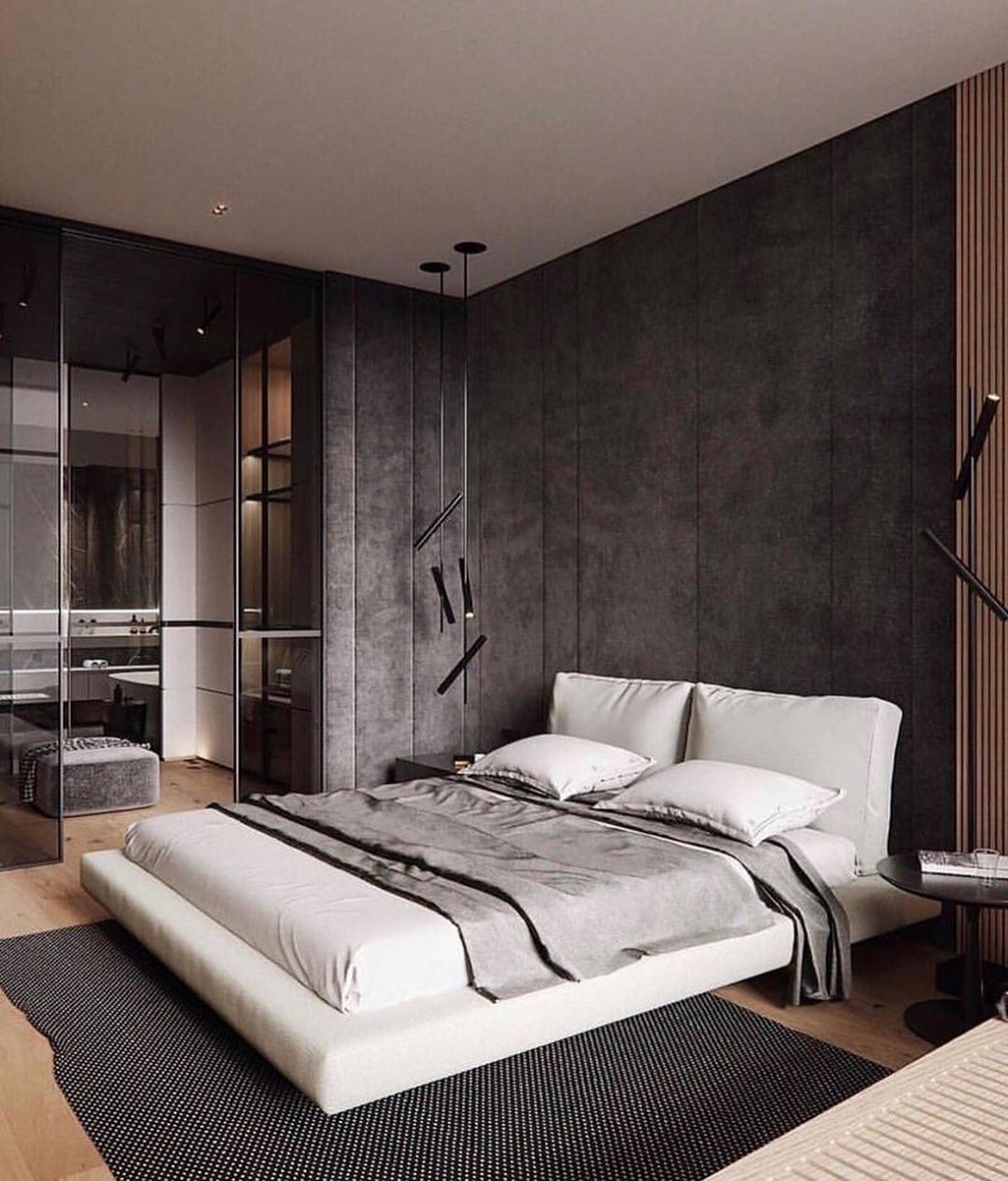 Bedroom designed in Modern style with gray walls and a bed with white sheets on a platform frame. Photo by Instagram user @architect_mustafayev