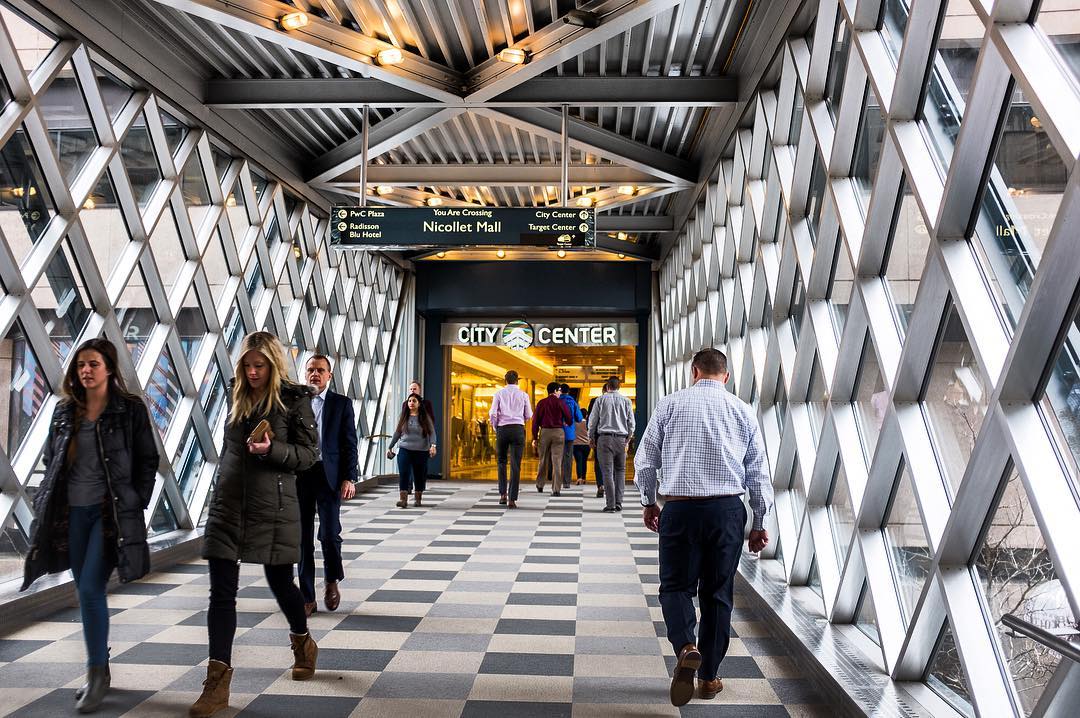 People walking across an indoor bridge. Photo by Instagram user @bumpopera