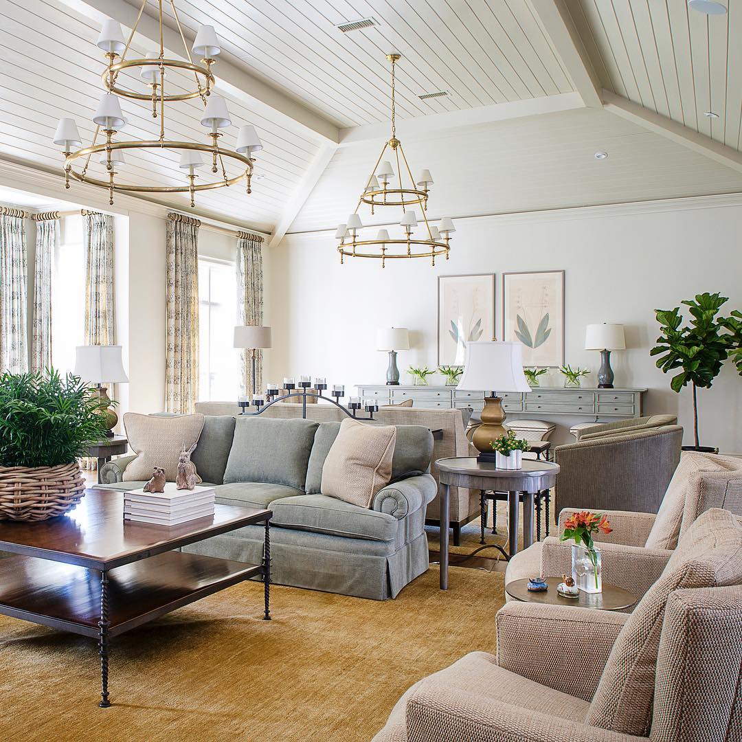 Living room design in Transitional style with gray and blush furniture with gold light fixtures. Photo by Instagram user @cindymccorddesign