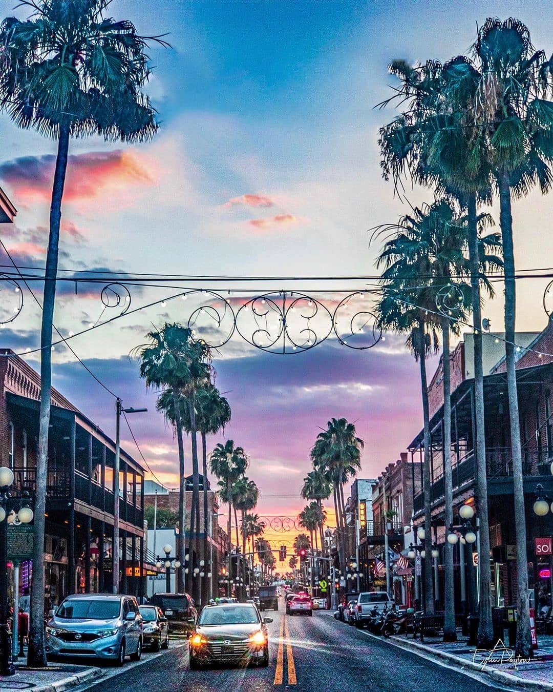Street view of Ybor City with purple skies as the sun sets. Photo by Instagram user @erinpaytonphotography