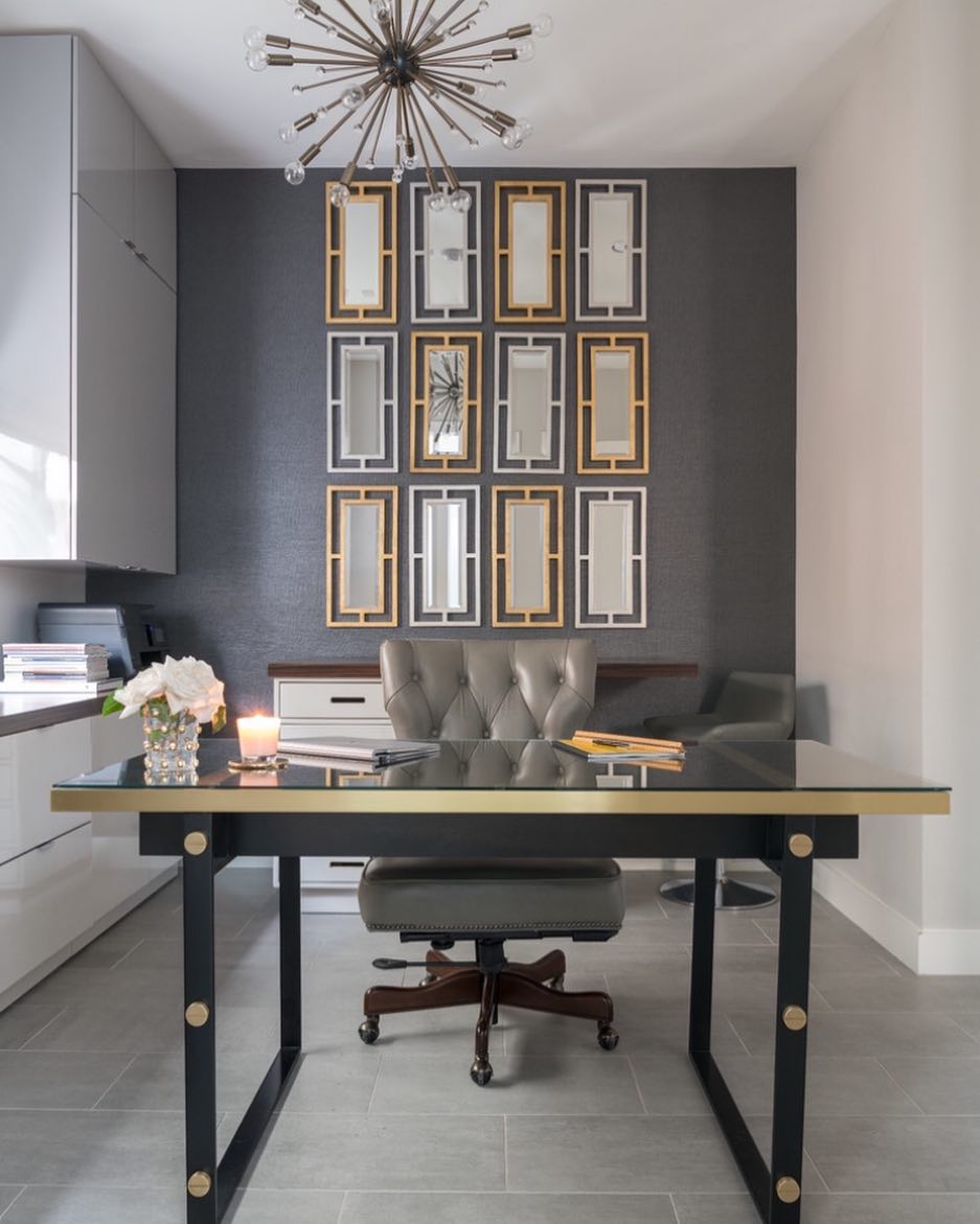 Home office with gray walls and gold wall decor and chair furniture. Photo by Instagram user @home.design4884