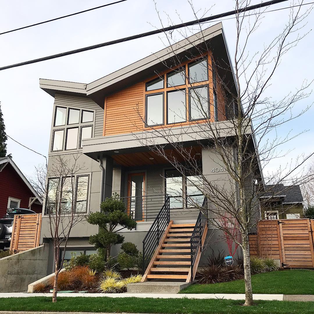 Contemporary two-story grey home mixed with wooden elements in Eastmoreland, Portland. Photo by Instagram username @portlandhomestories