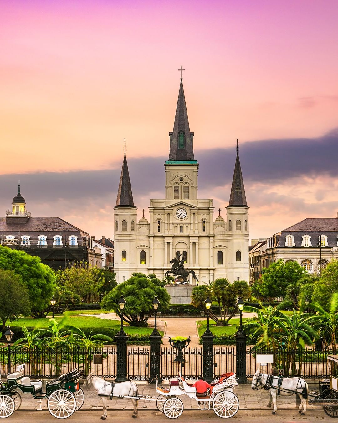 White St. Louis Cathedral with a purple sunset in New Orleans. Photo by Instagram user @tripadvisor