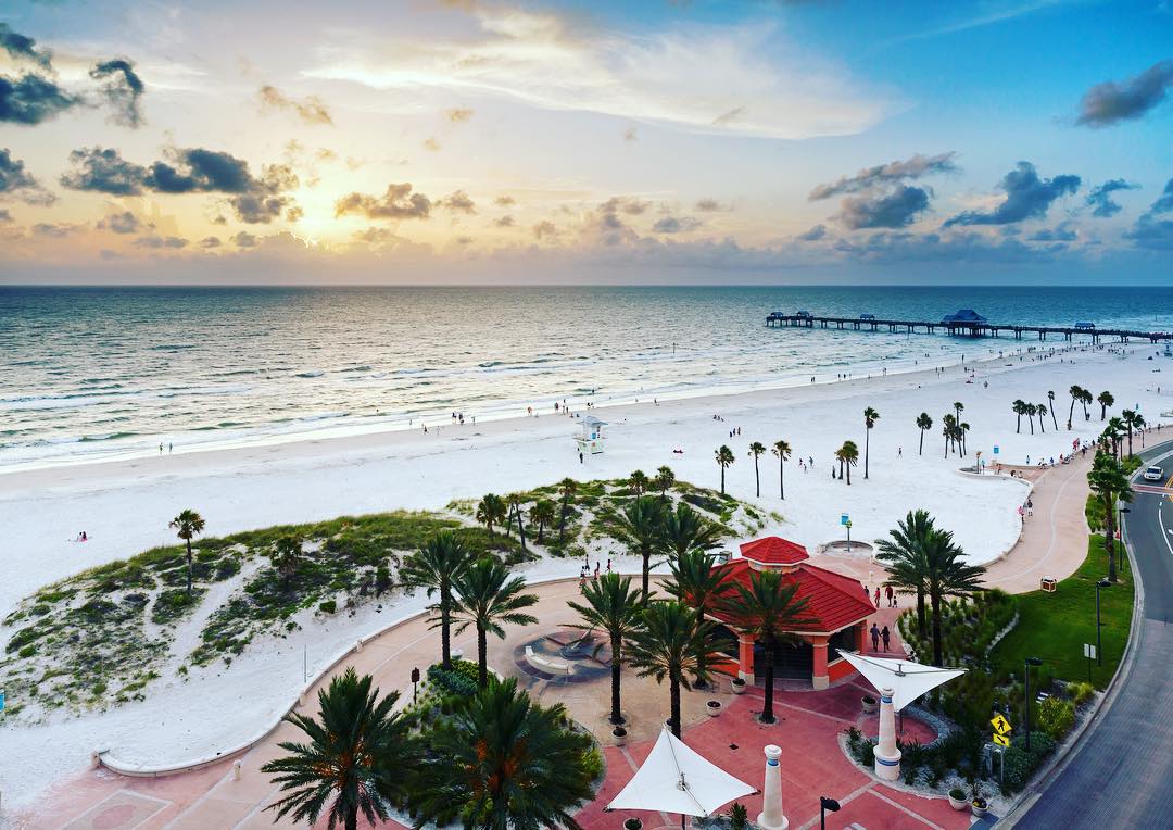 Aerial view of the ocean with white sand beaches at sunset in Clearwater, FL. Photo by Instagram user @myclearwater