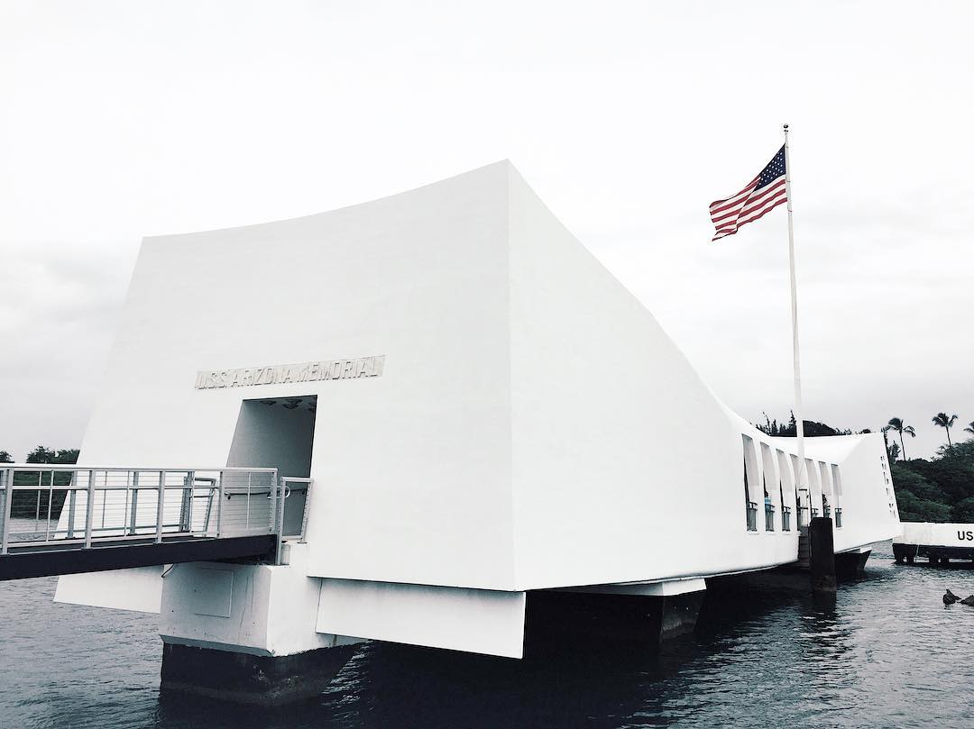 All white USS Arizona Memorial building hovering on water. Photo by Instagram user @dcarlo7