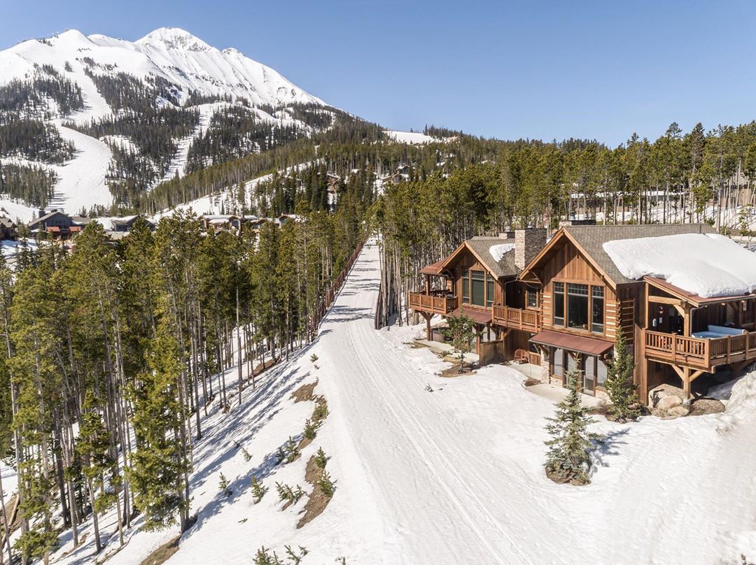 Mountain lodge in snow in Big Sky, MT. Photo by Instagram user @naturalretreats
