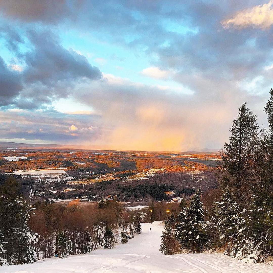 Sunrise over snowy mountains in The Poconos, PA. Photo by Instagram user @johnjward