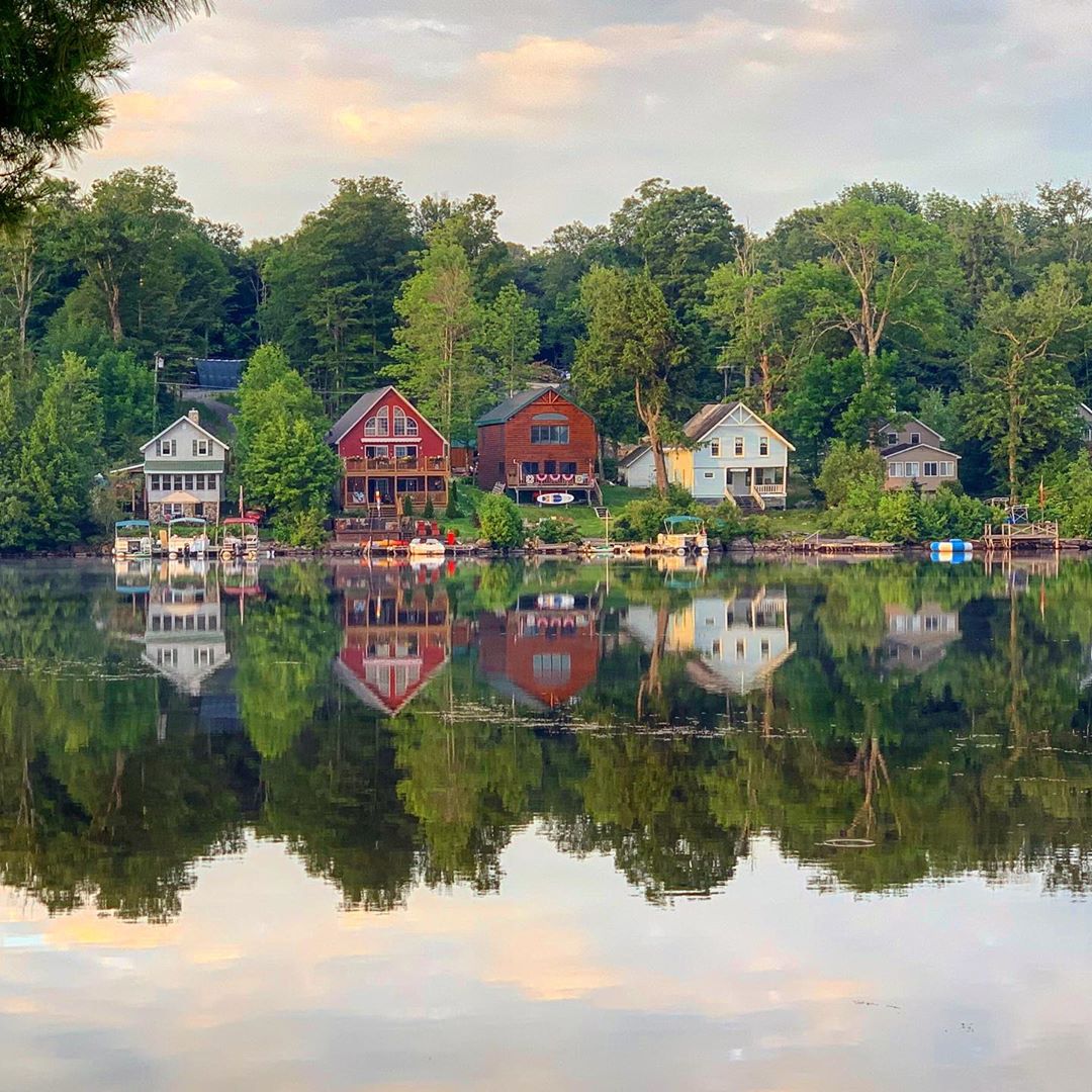 Row of lake houses on Caroga Lake, NY. Photo by Instagram user @speakinglens