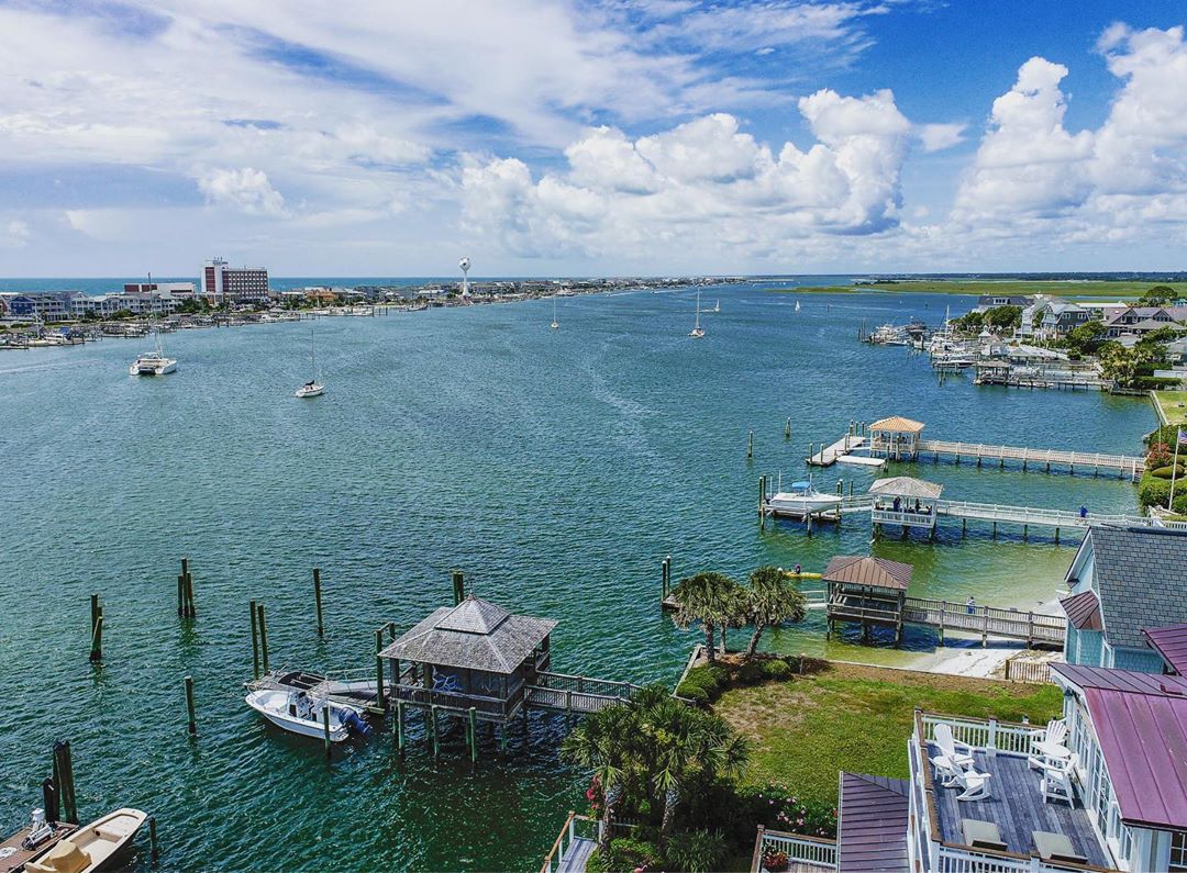 Aerial view of the water and boats in Wrightsville Beach, NC. Photo by Instagram user @docuvidglobal