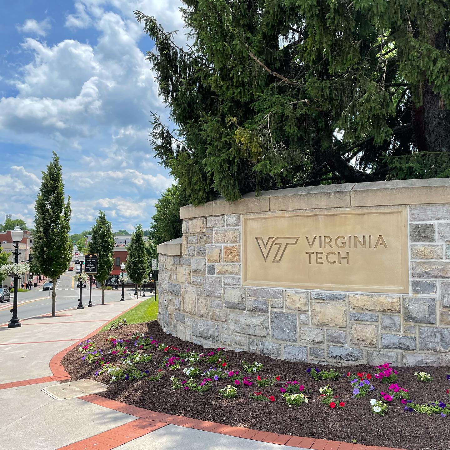 A stone sign that reads "Virginia Tech" on the campus of the school. Photo by Instagram user @vt_engineering.