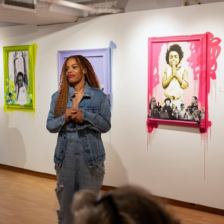 Artist Blu Murphy speaking in front of an audience at her "LE DRIP: The Unobtainable Sauce of Black Essence" exhibition. Photo by Instagram user @targetgallery.