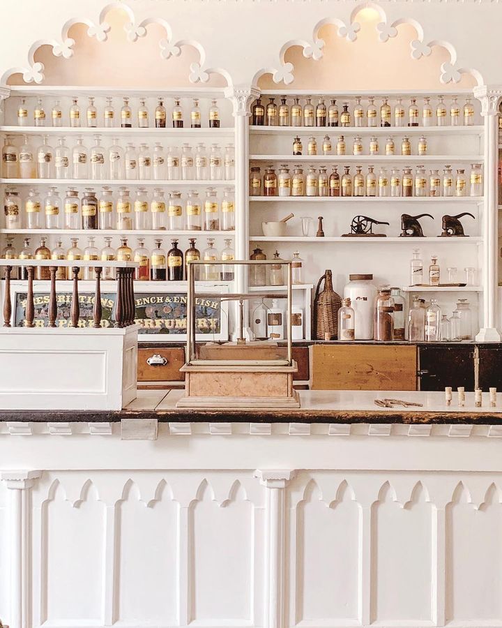 The white countertops and shelves full of old pharmaceutical bottles at the Stabler-Leadbeater Apothecary Museum. Photo by Instagram user @skylar_arias_adventures.