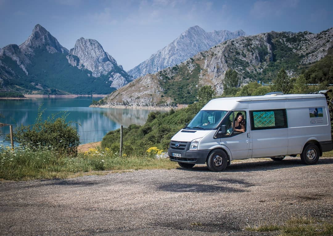 White cargo van near a lake and mountains. Photo by Instagram user @kangurfamily