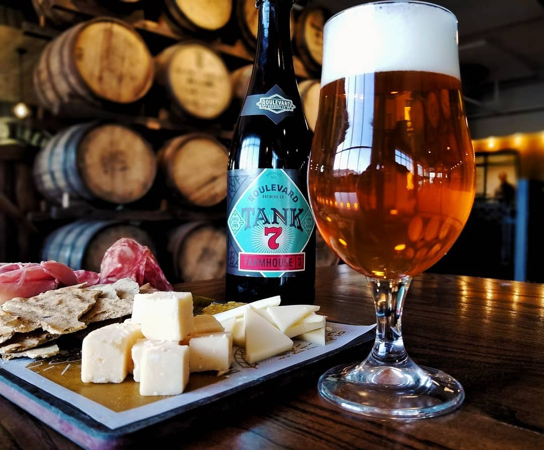 Bottle of beer next to a meat and cheese board. Photo by Instagram user @boulevard_beer