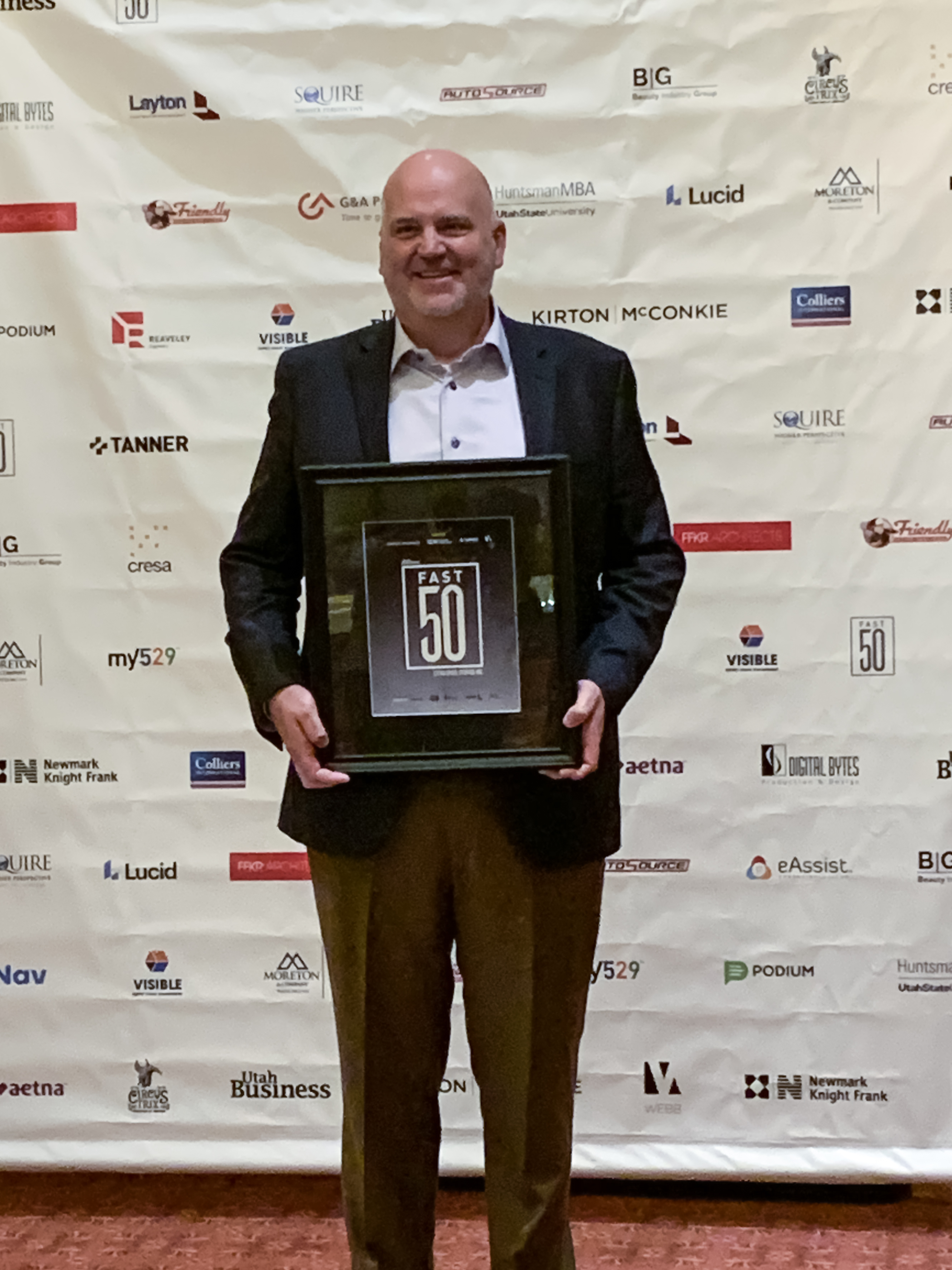 Scott Hansen of Extra Space Storage accepts 2019 Fast 50 Award from Utah Business