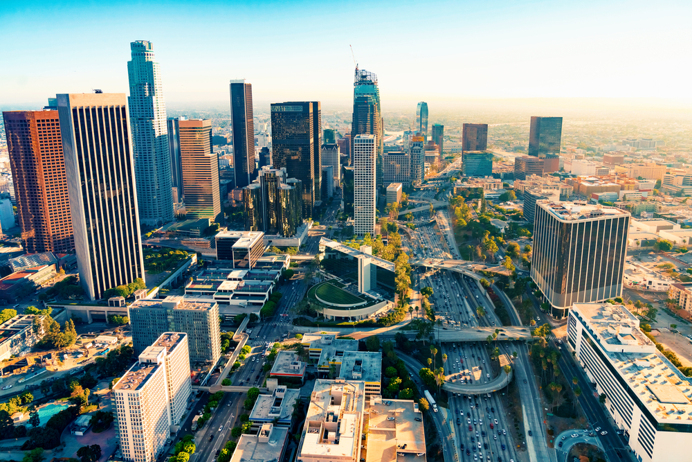 Aerial view of busy Los Angeles streets and skyscrapers at dawn