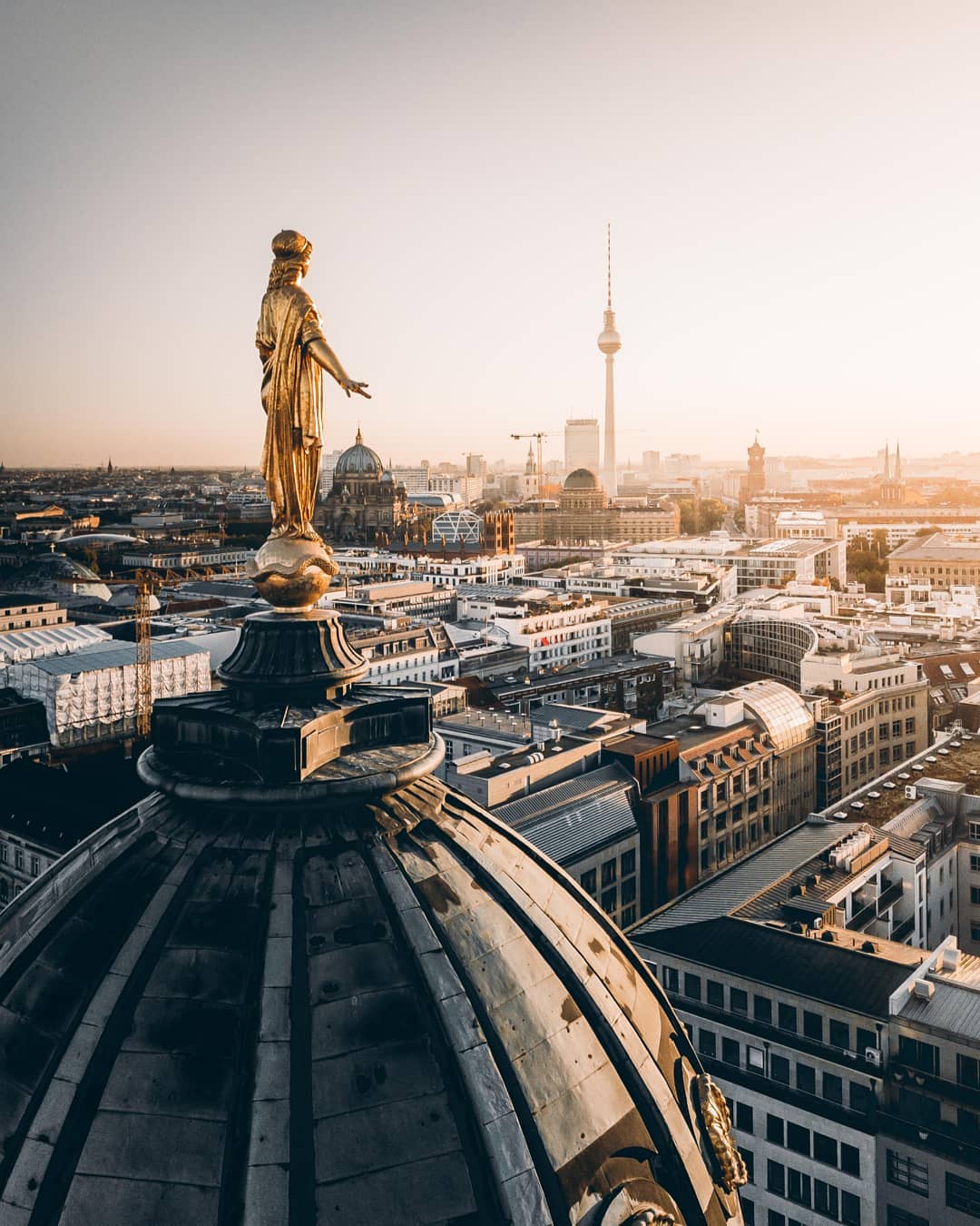 Skyline of Berlin gold statue on church. Photo by Instagram user @ferditakesphotos