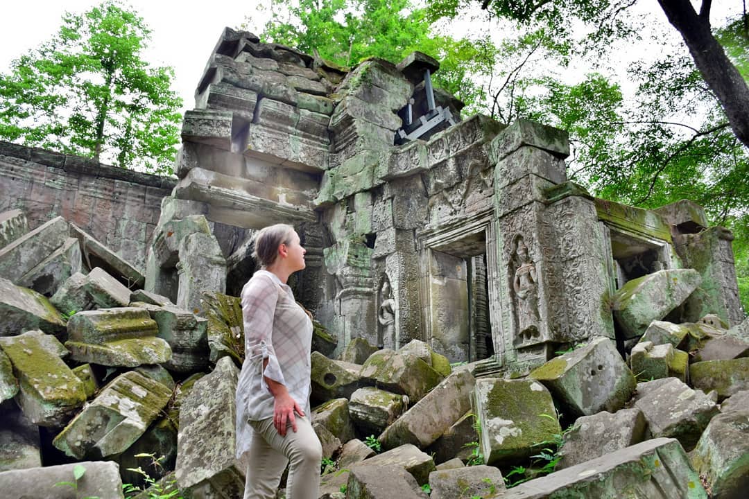 Girl standing in front of temple rubble. Photo by Instagram user @mappingmegan