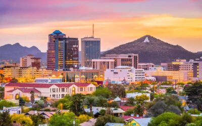 Skyline of tall buildings and a mountain during sunset in Tucson