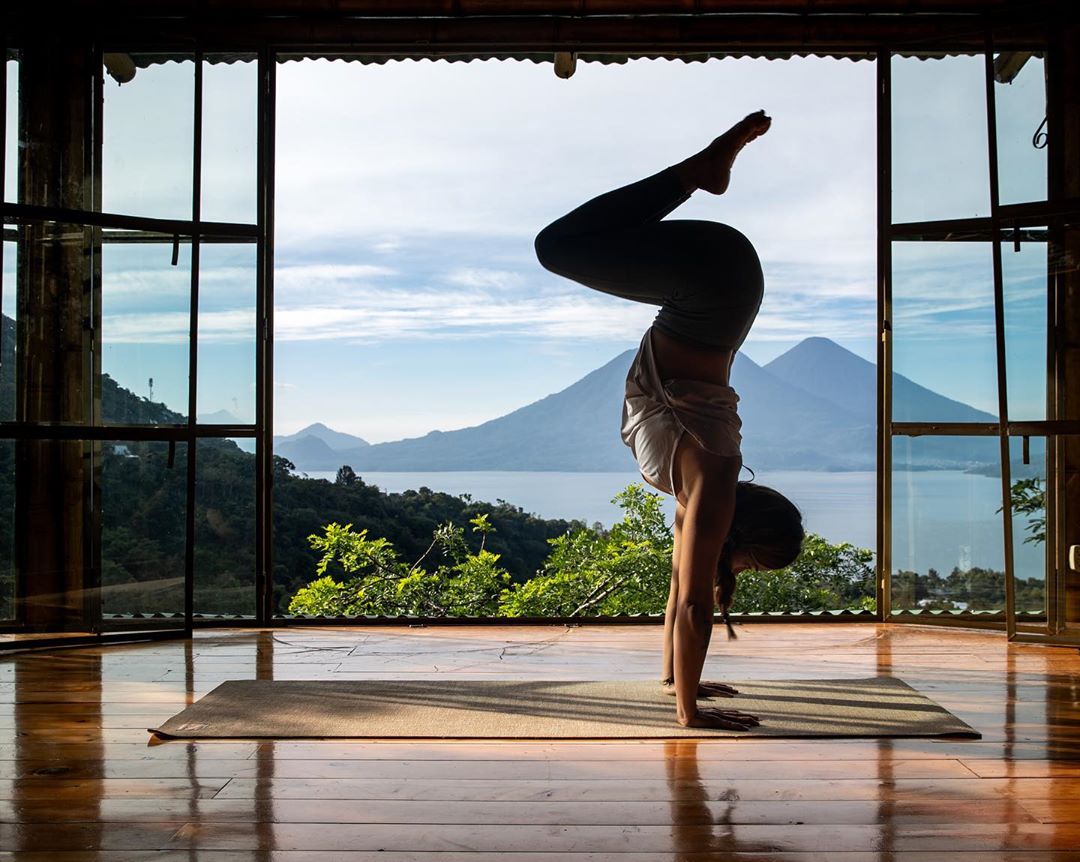 Yoga instructor posing in Lake Atitlan. Photo by Instagram user @yogawithgabby