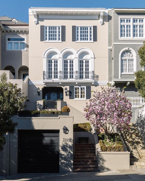 tan and white home with balcony in Pacific Heights - photo via Sweatbros
