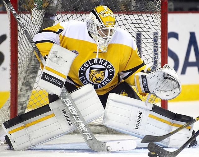 A hockey golalie stopping a puck from Colorado College. @goaligram