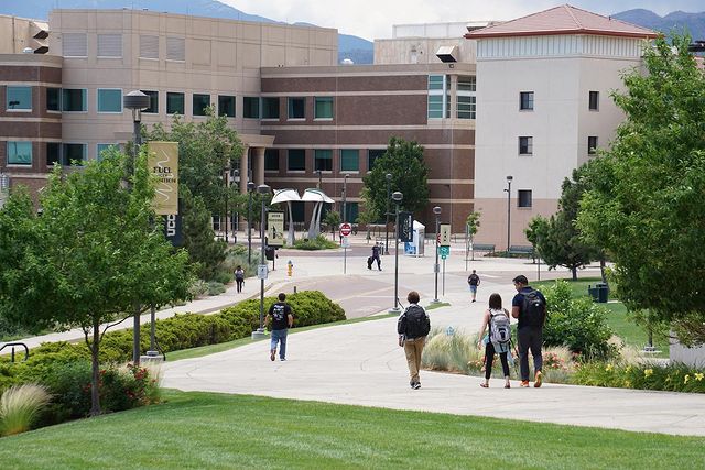 Students walking outside on the University of Colorado Colorado Springs campus. @uccs
