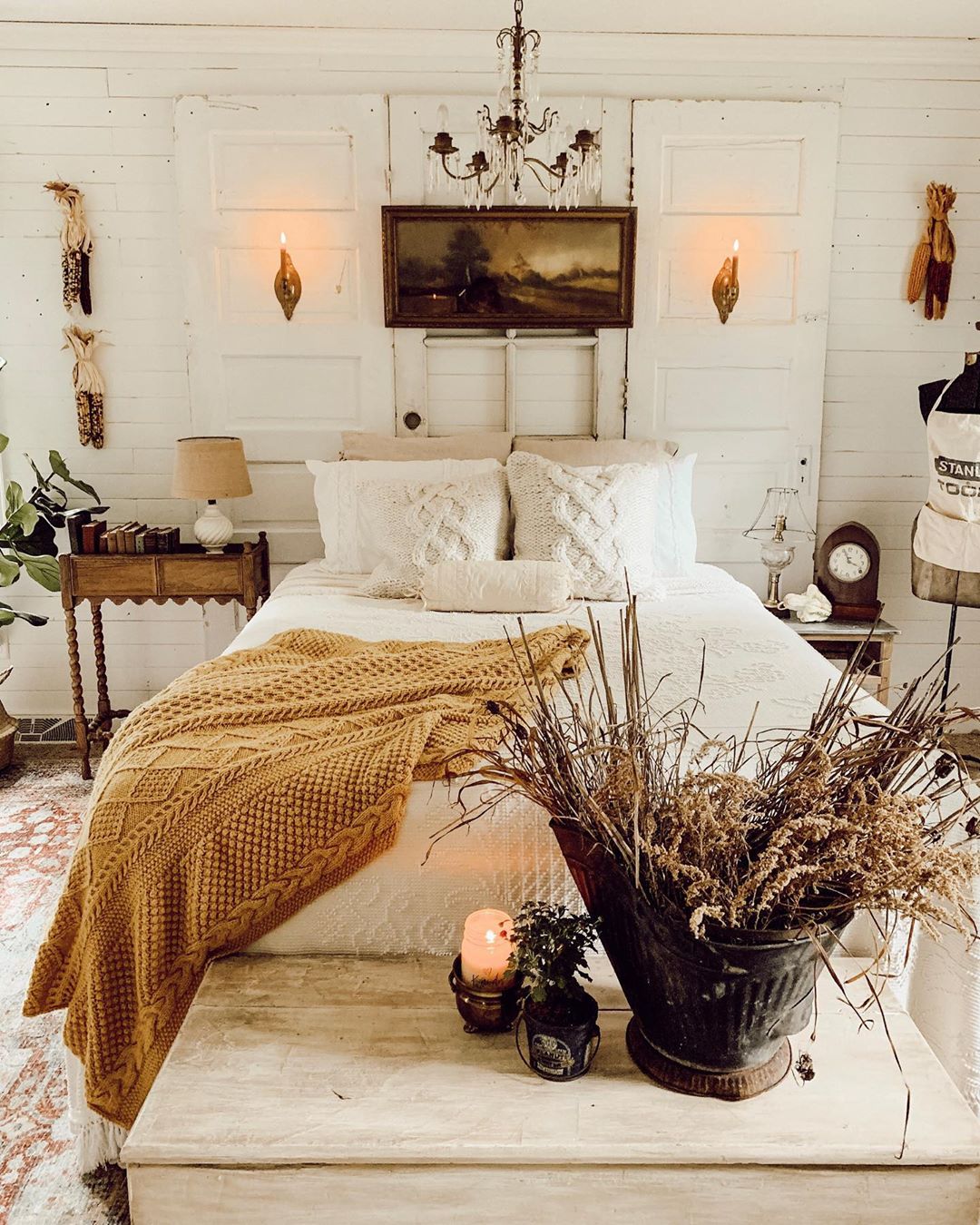 White bedroom with antique decor. Photo by Instagram user @candlewoodcottage 