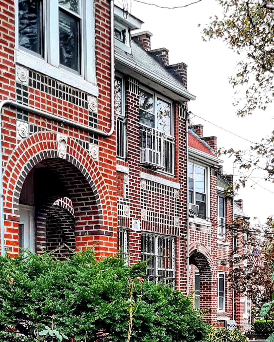 Red brick house with white trim. Photo by Instagram user @rochdalian