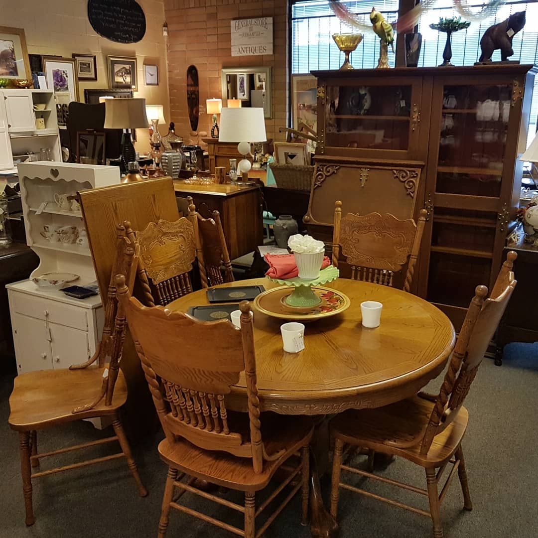 Antique brown table and chairs. Photo by Instagram user @goods_at_the_hoods
