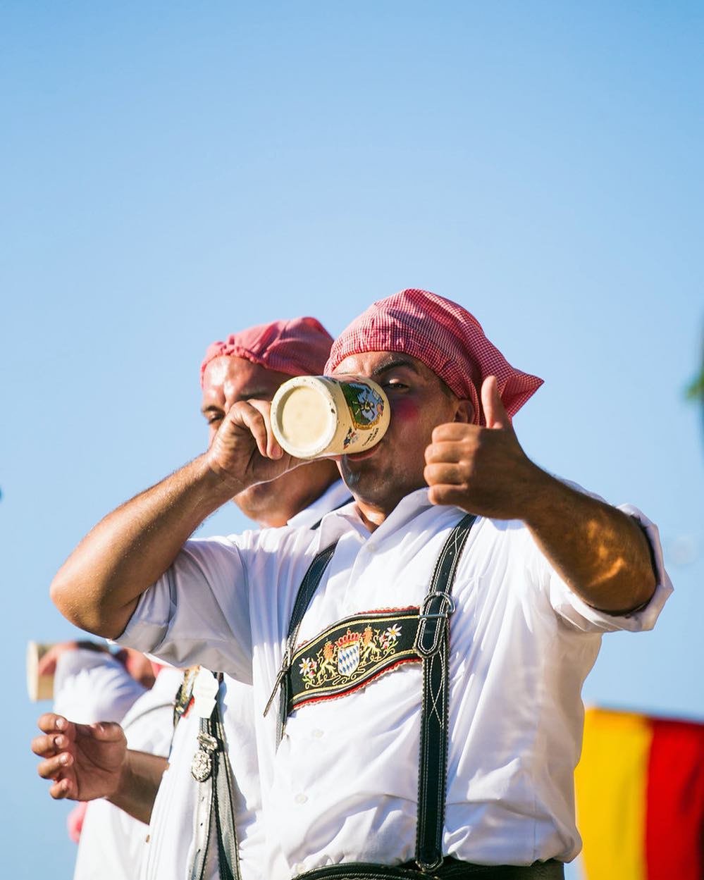 Two guys drinking beer at a German festival. Photo by Instagram user @germanfest