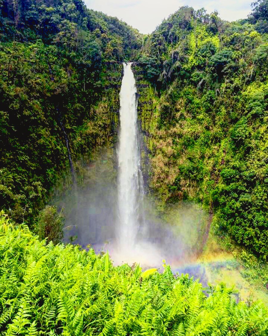 Giant waterfall with rainbow mist in Hilo. Photo by Instagram user @saltwatersven