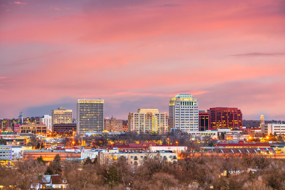 Skyline of tall buildings in Downtown Colorado Springs at sun rise
