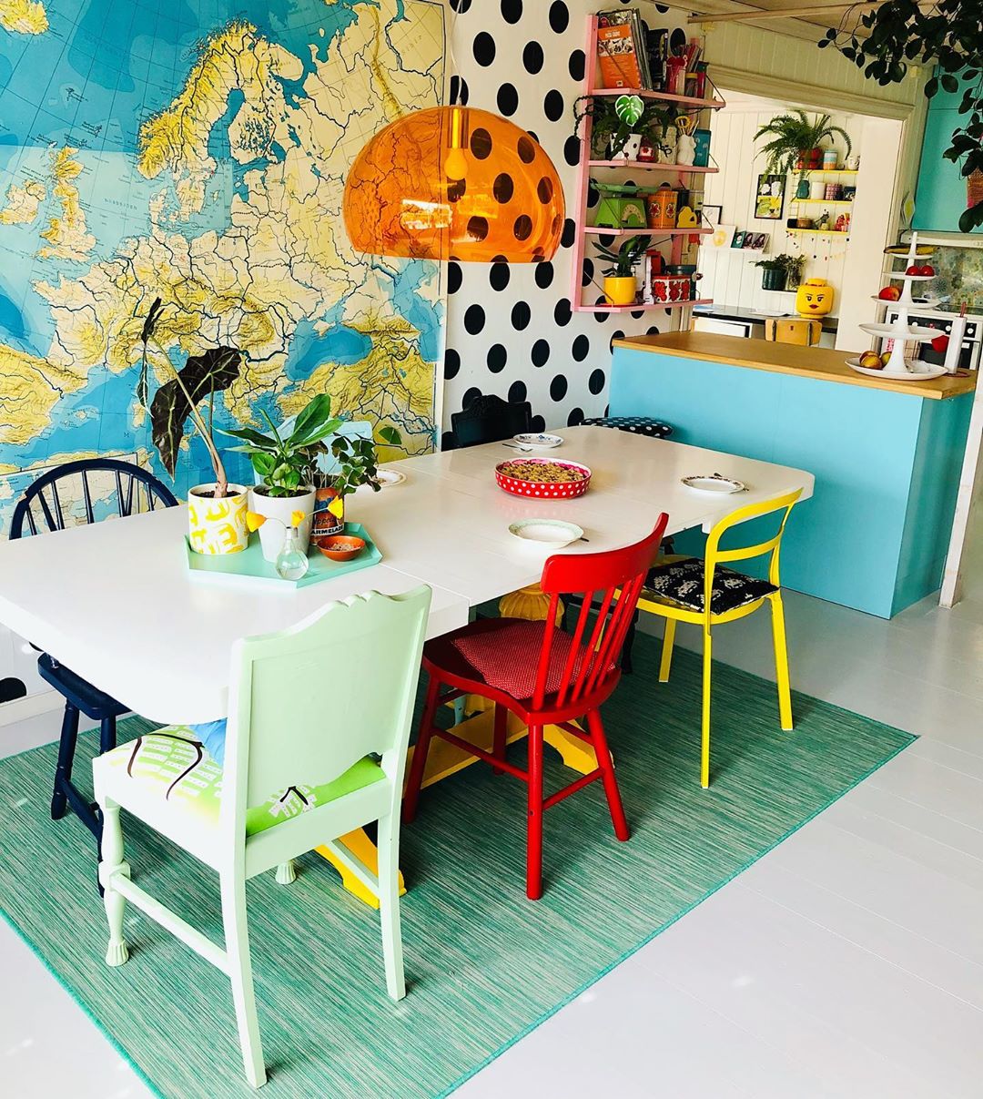 Kitchen with multicolored chairs and polkadot walls. Photo by Instagram user @polkadotgrid