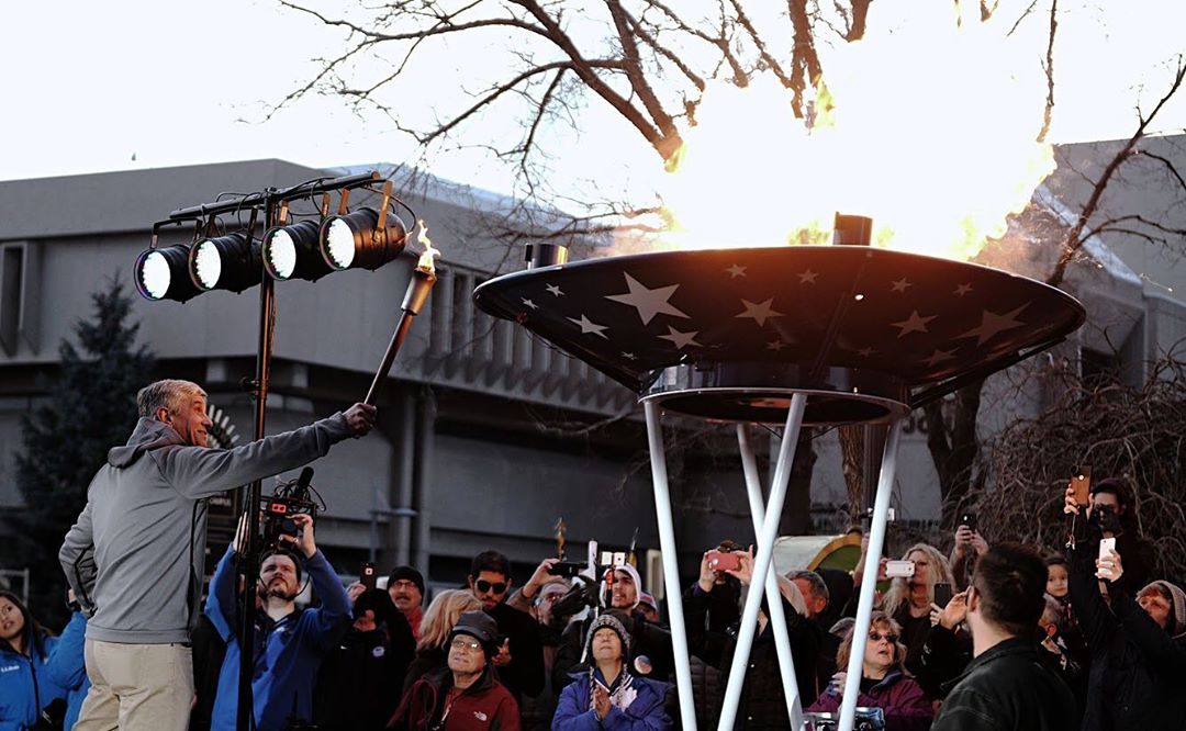 Guy lighting the Olympic torch. Photo by Instagram user @olympiccityusa