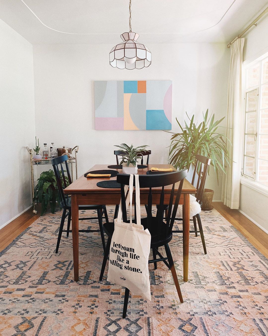 Dining room with vintage Tiffany lamp. Photo by Instagram user @clothesandpizza