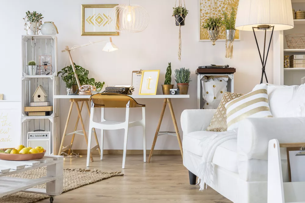 Living room with light colored walls and white couch