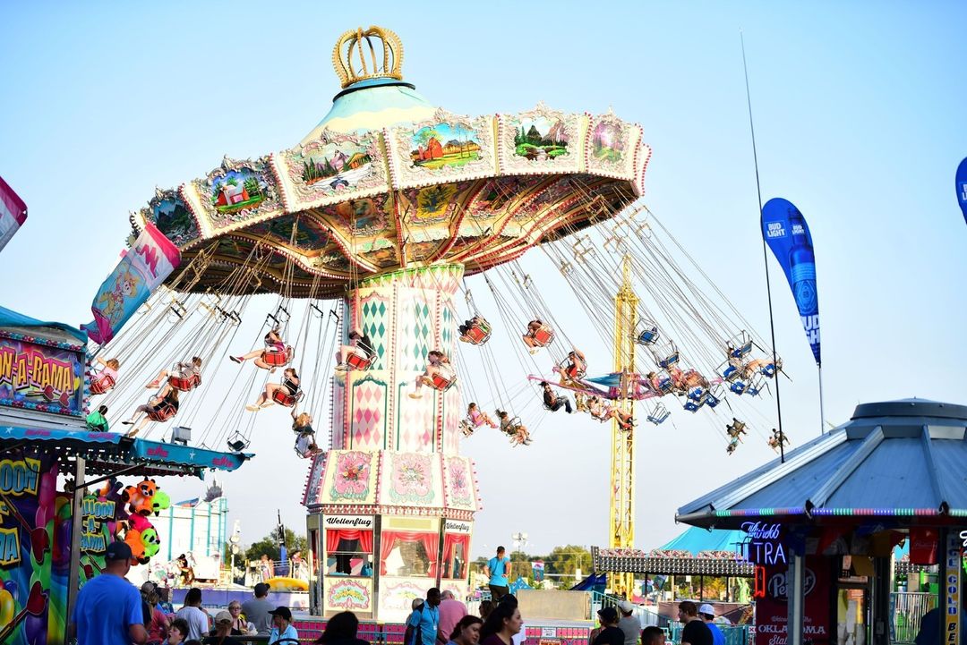 A carousel spins at The Oklahoma State Fair. Photo by Instagram User @okstatefair.