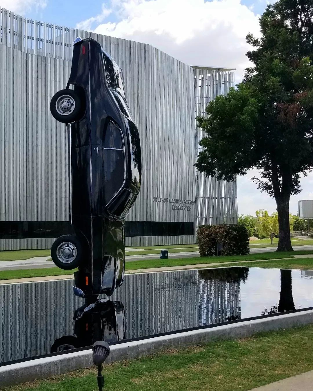 A car is suspended horizontally. Photo by Instagram User @cheney.in.the.city.