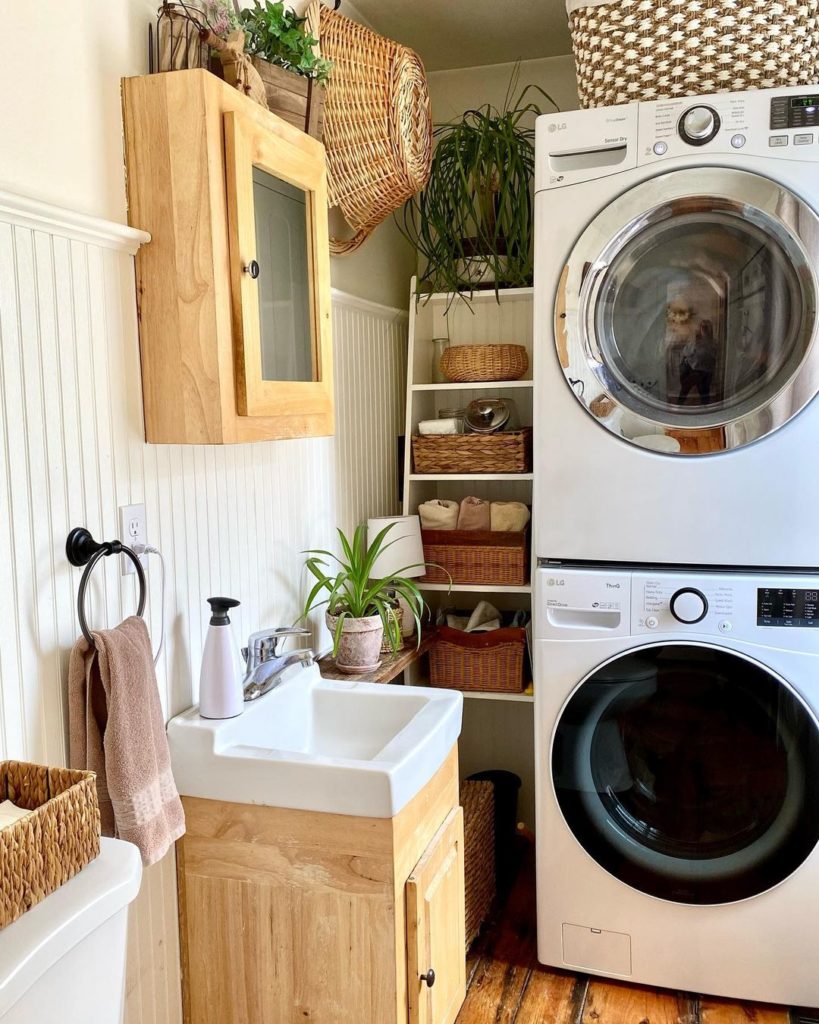 Stacked washer and dryer with organizing shelf on side. Photo via Instgram user @thelongawaitedhome