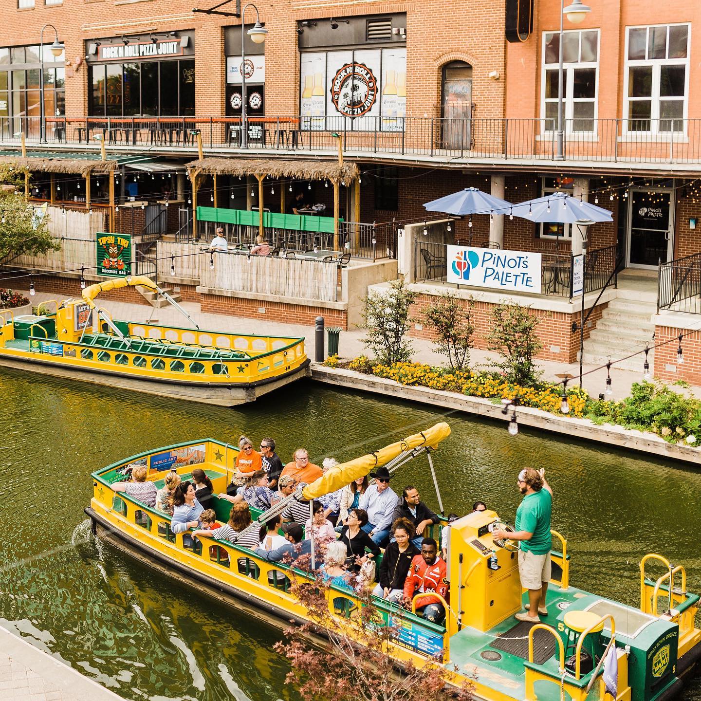 The Bricktown Water Taxi strolls down a canal. Photo by Instagram user @bricktown.