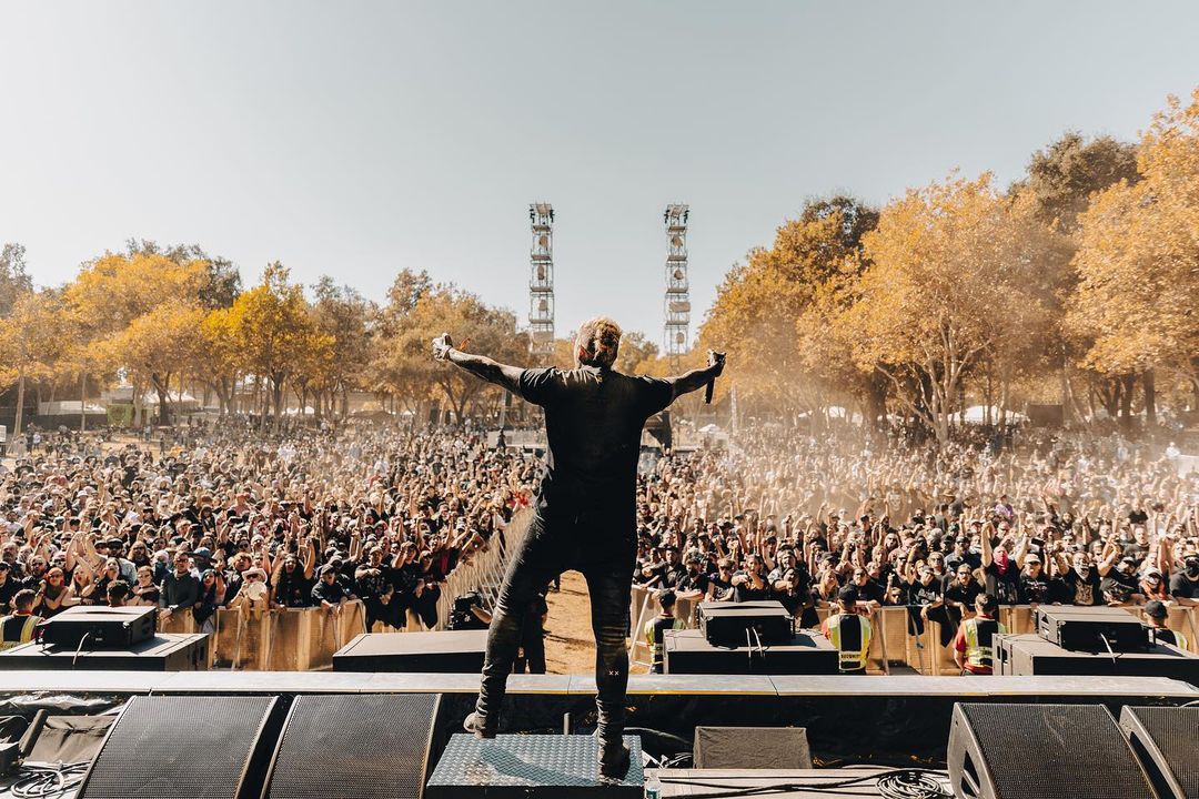 A person standing in front of a crowd at the Aftershock Festival. Photo by Instagram user @aftershockfestival