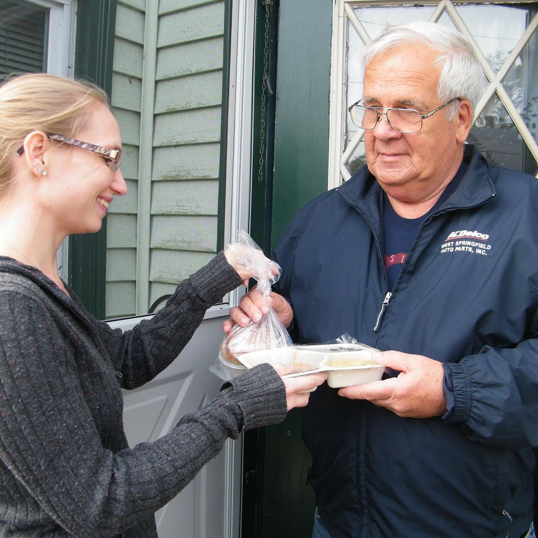 Woman delivering food to man. Photo by Instagram user @tvnutritionprogram