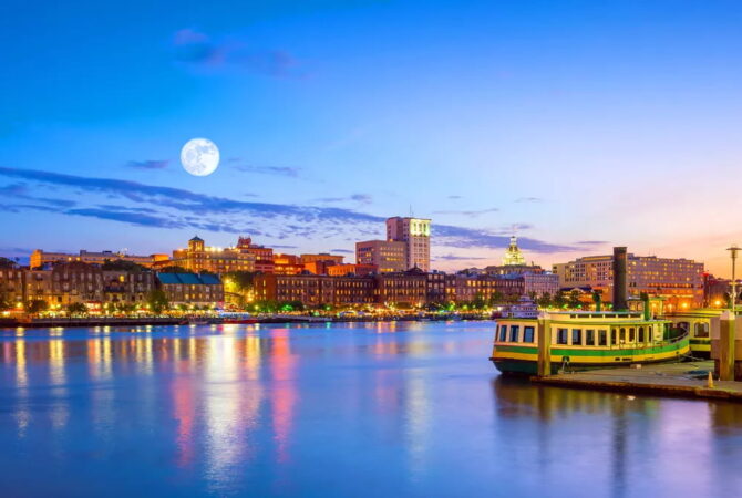 Skyline of water and Downtown Savannah at night